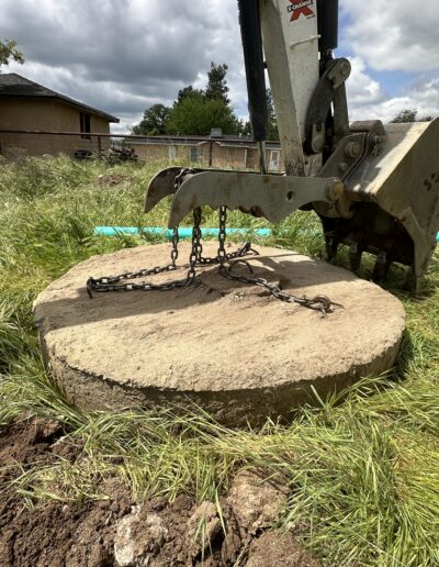 Installation of a dry well drop tee, showing the connection of the tee to the drainage system for proper water flow